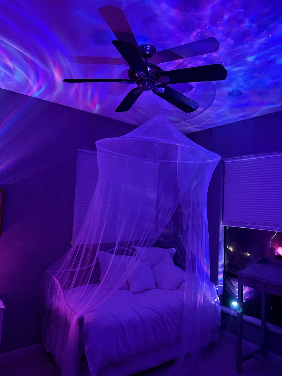 A real bedroom under an aurora and laser light canopy
