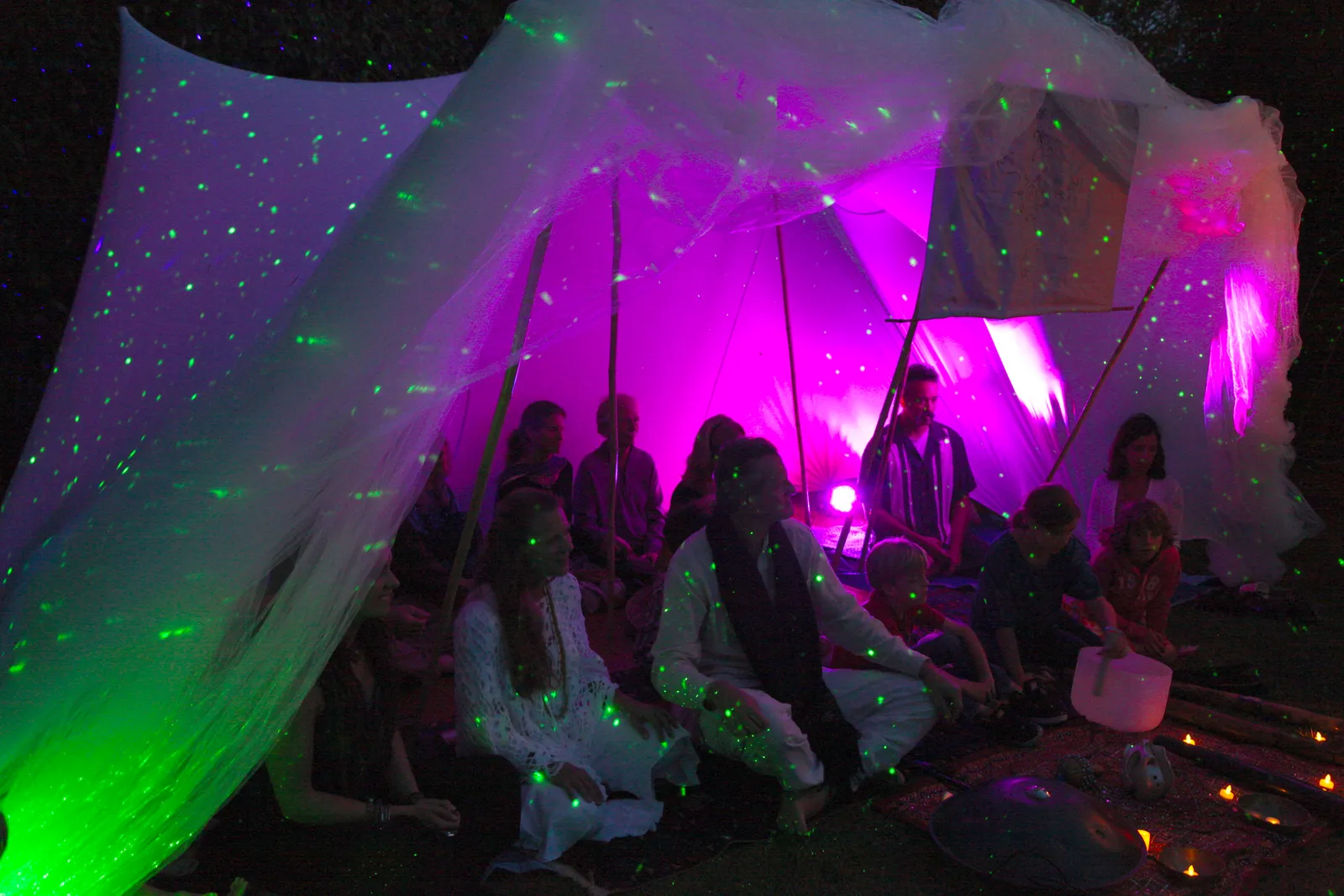 Night gathering lit with warm ambient light